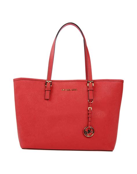 michael kors perforated logo red bag|Michael Kors red tote bag.